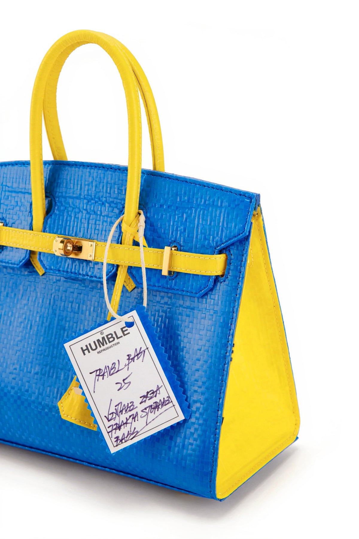 Travel Bag Size 25 Blue/Yellow — angled view of yellow side panel and handles