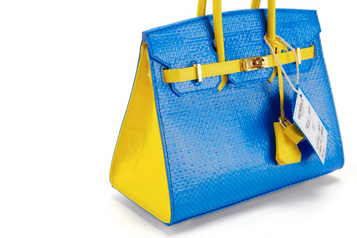 Travel Bag Size 25 Blue/Yellow — angled view of blue front and yellow side panel
