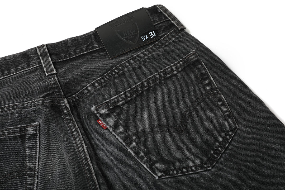 HUMBLE x HTC Gemstone Studded Black Jeans — close-up of back pocket and waistband label