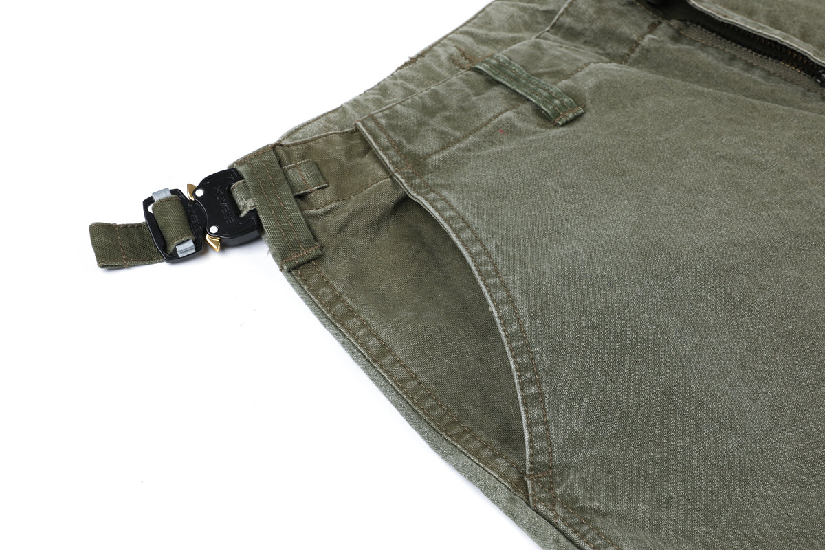 Jungle Chopped Shorts — waist adjustment buckle and side pocket detail